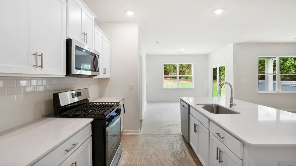 Kitchen with stainless steel appliances.