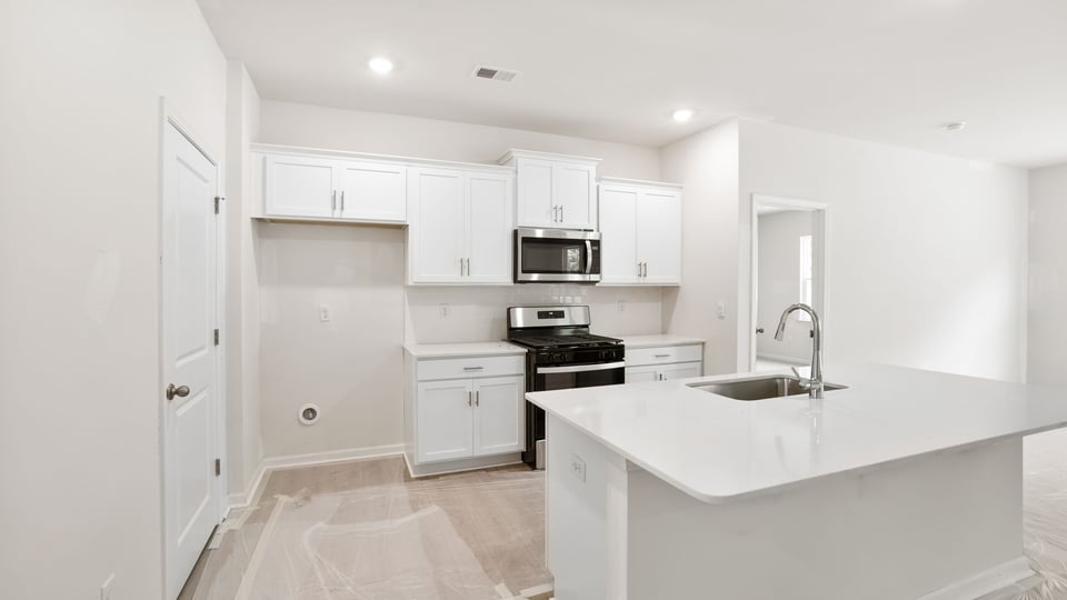 Kitchen with stainless steel appliances.
