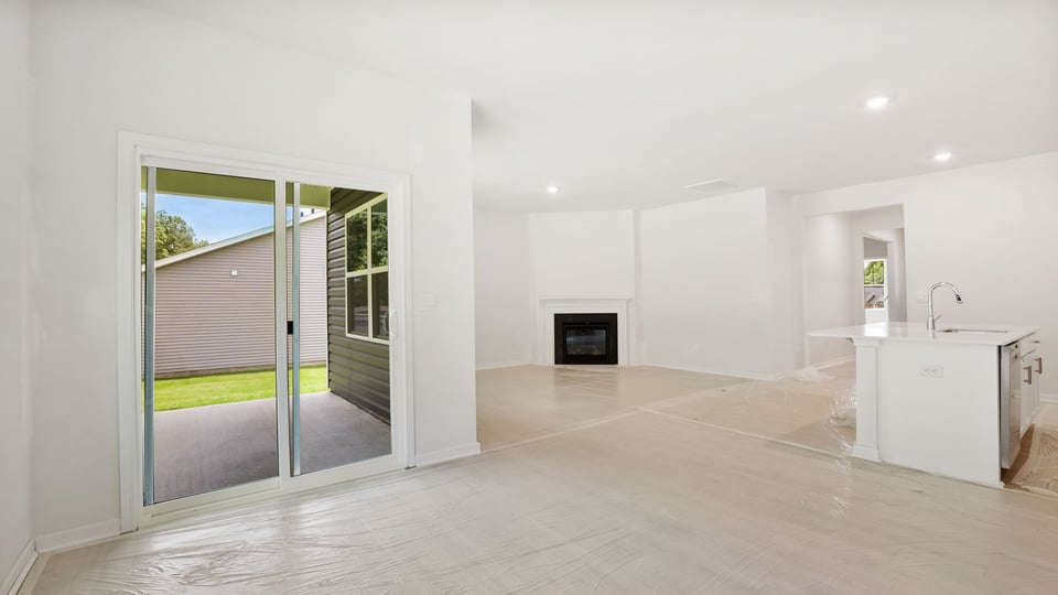 Family room with fireplace and window.
