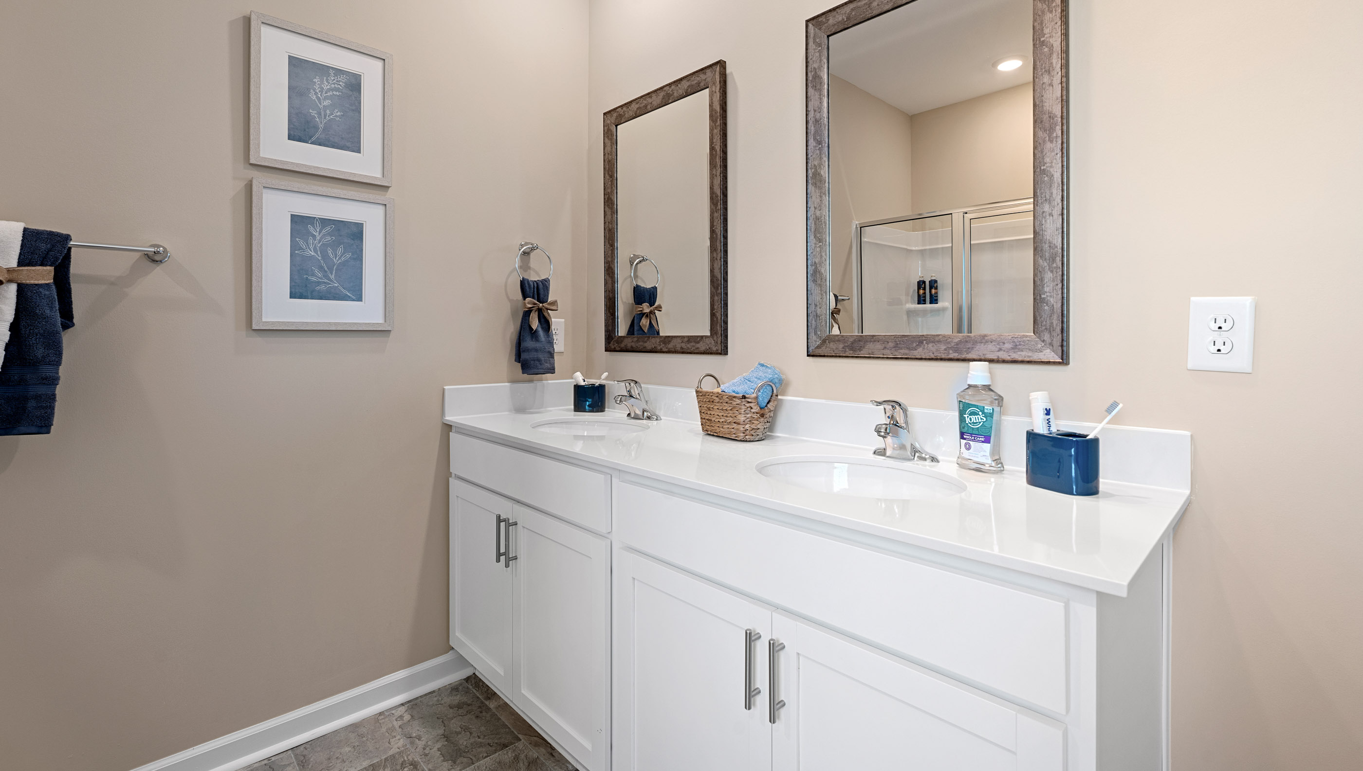 Primary bathroom with double vanity sinks.
