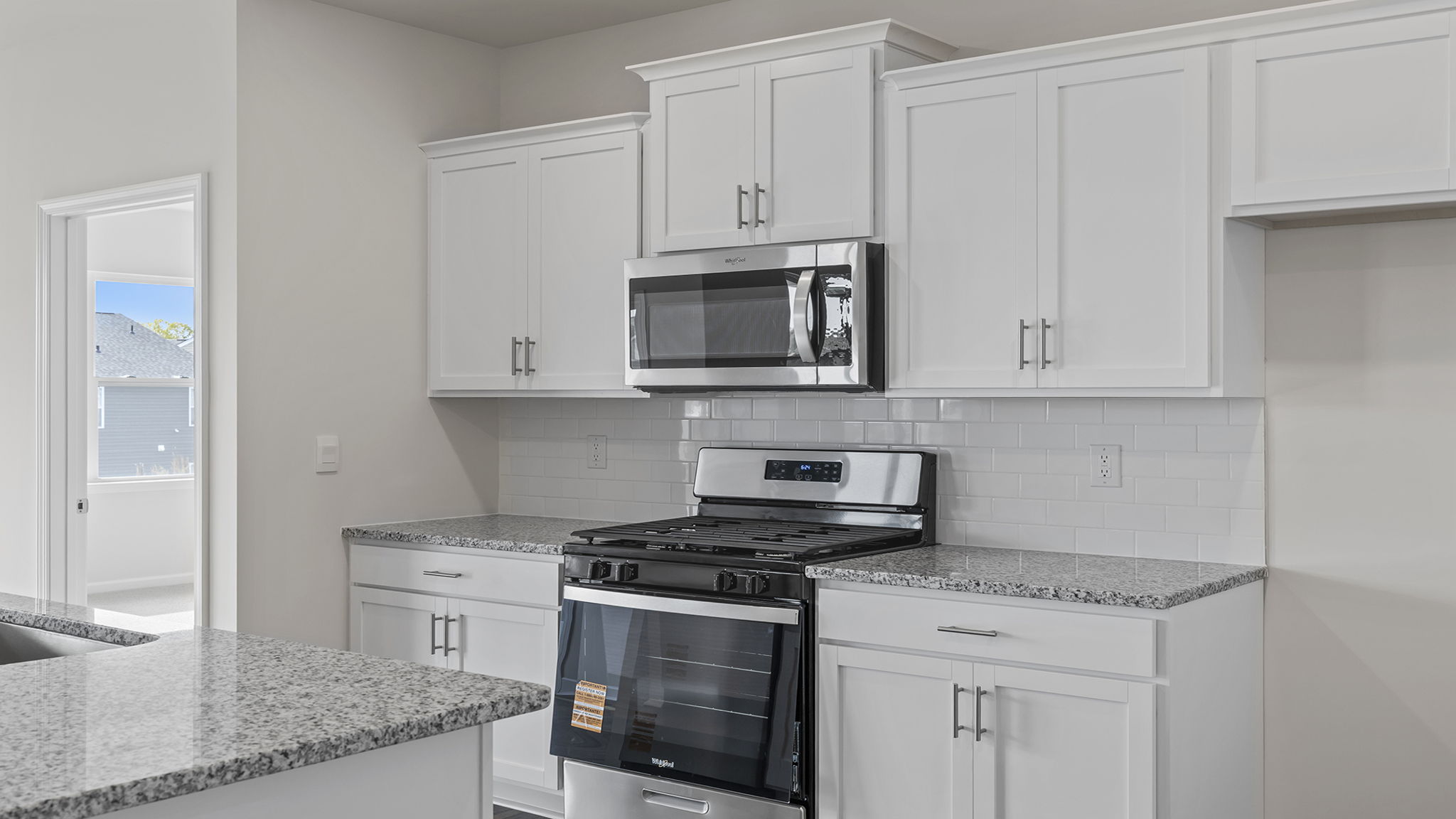 Kitchen with island and cabinets.
