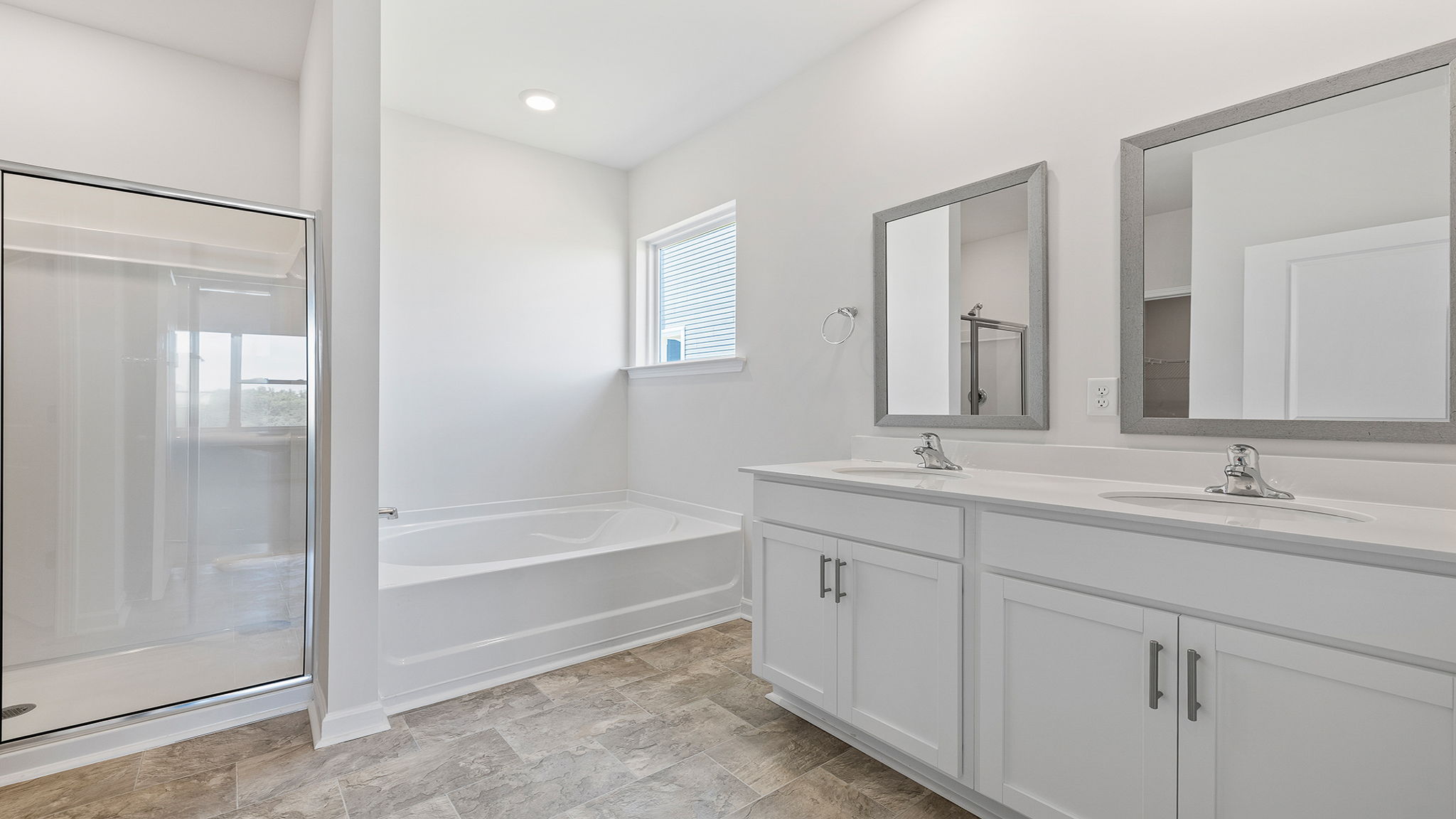 Primary bathroom with dual sink vanity.