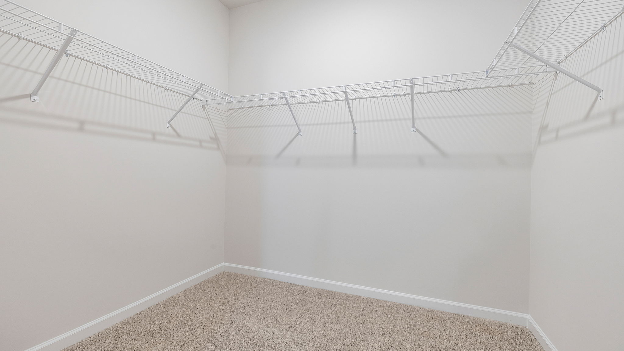 Primary bedroom walk-in closet.