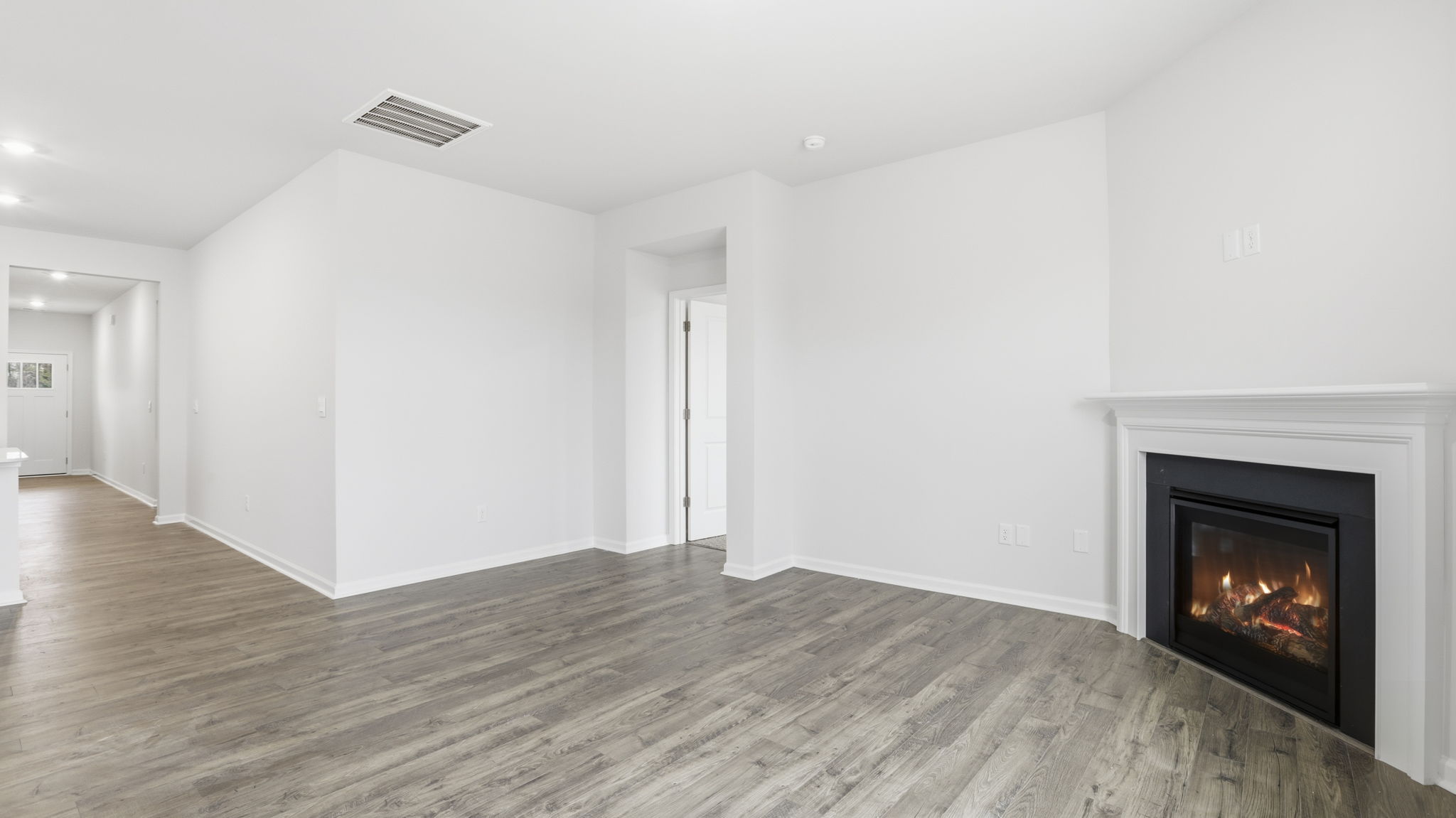 Family room and view of hallway to the entrance.