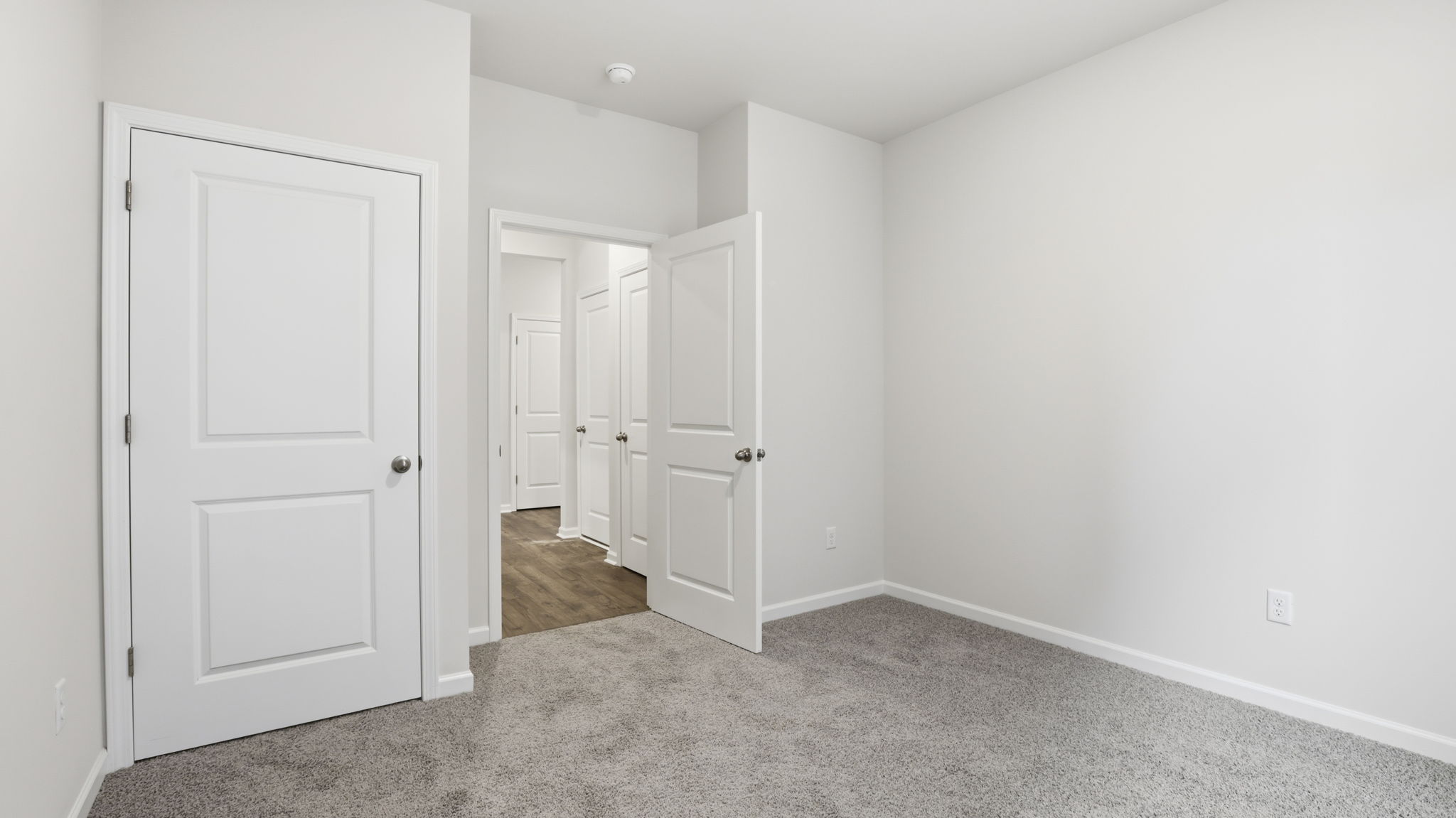 Bedroom with carpet.