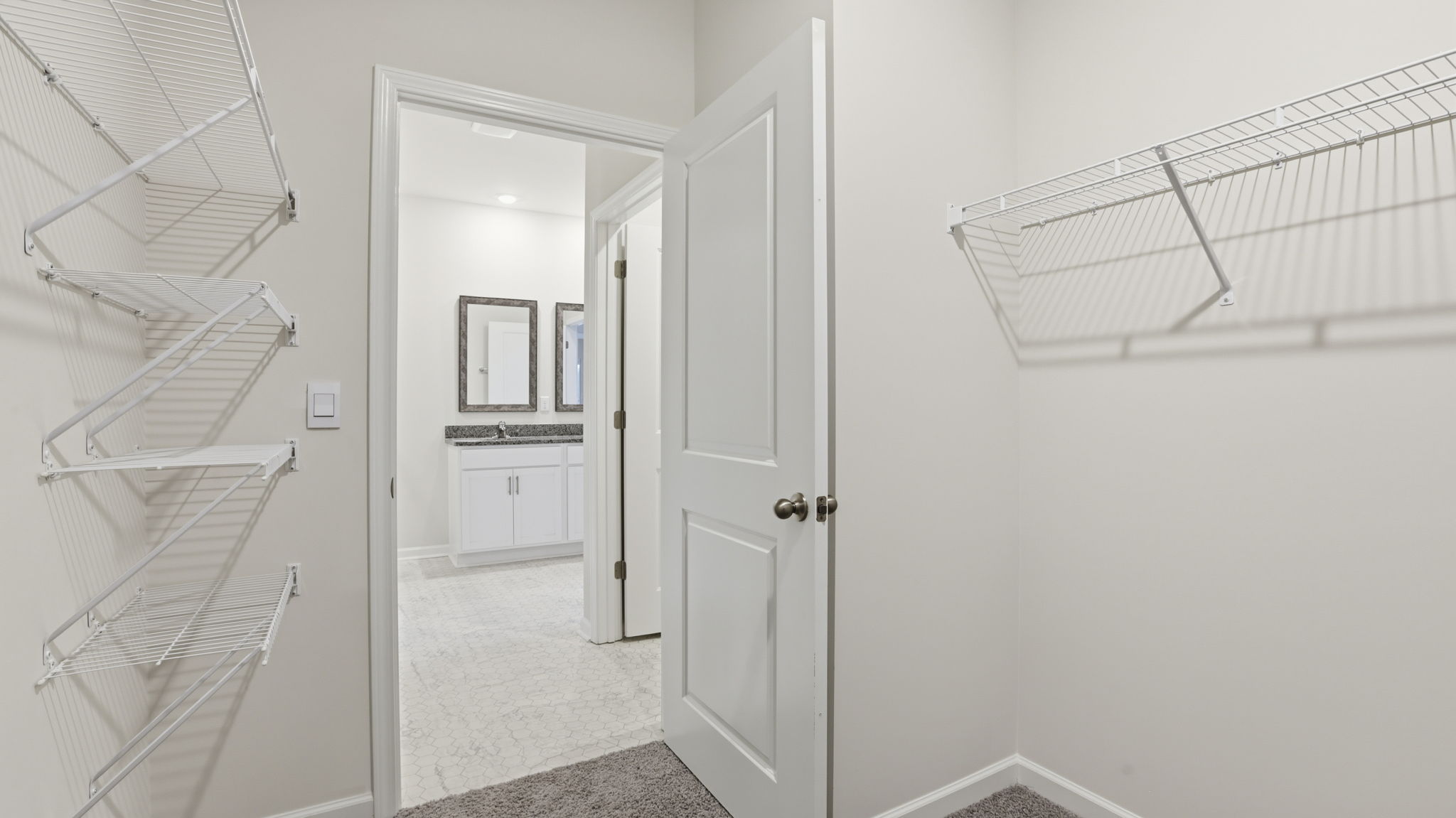 Primary bedroom walk-in closet.