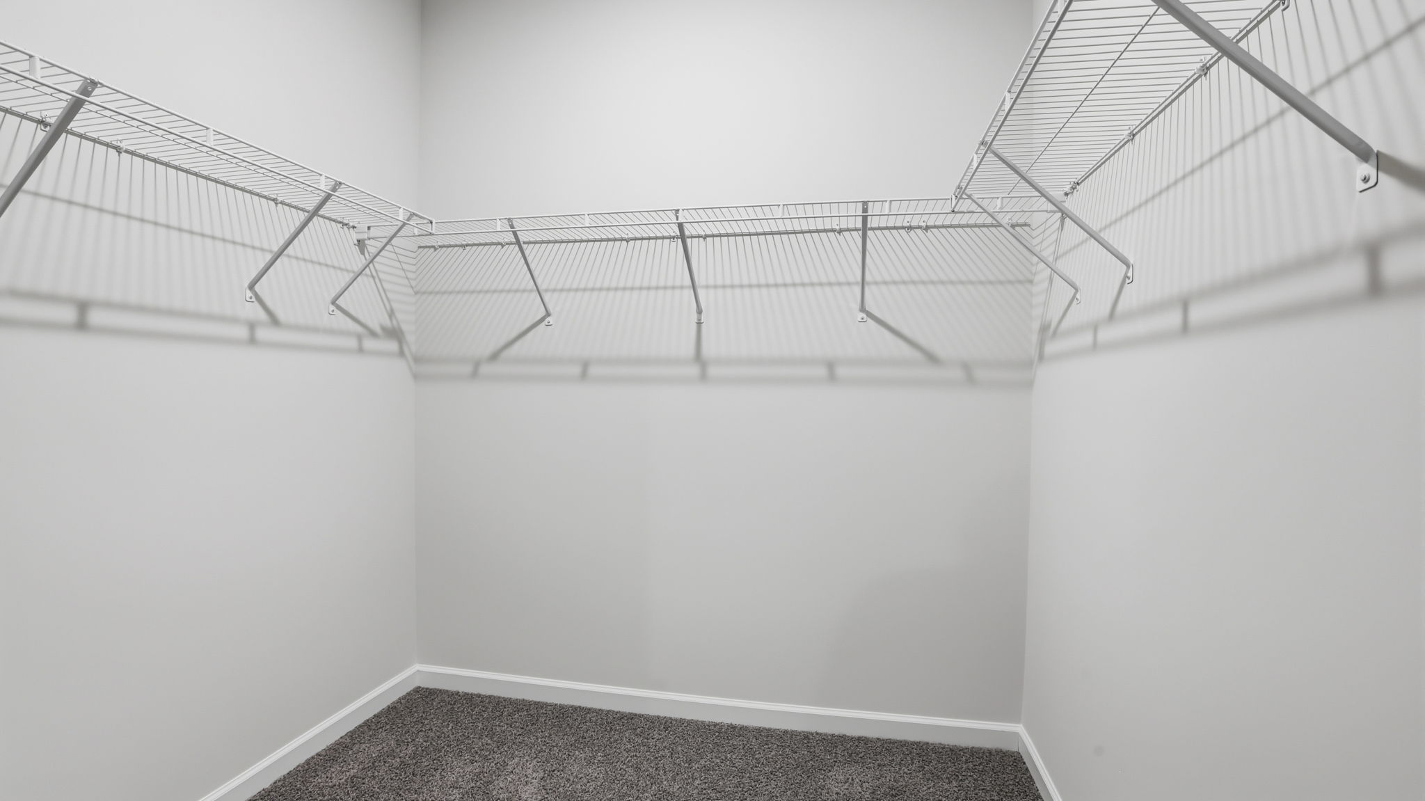 Primary bedroom walk-in closet.