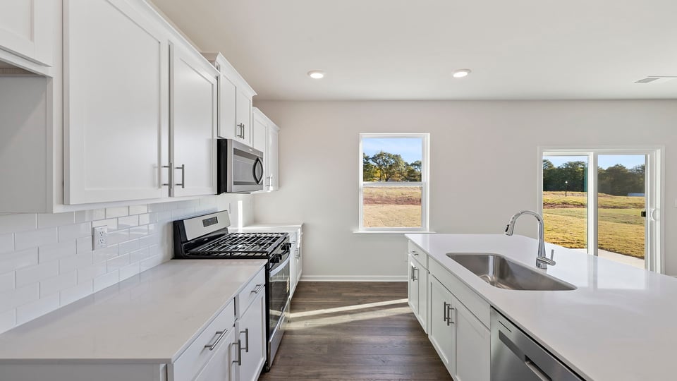Kitchen with island and windows.