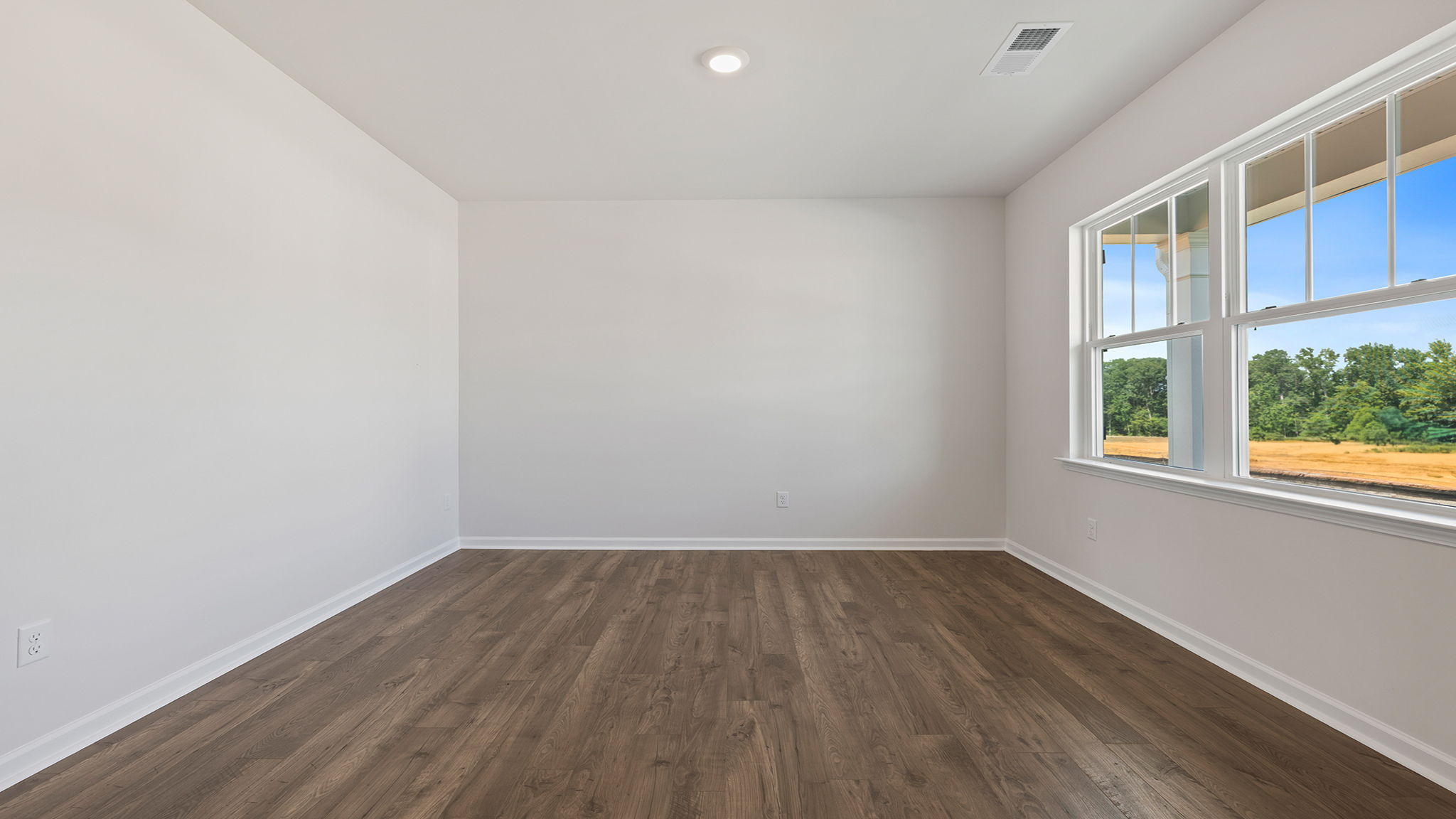 Study located at front of home with window.