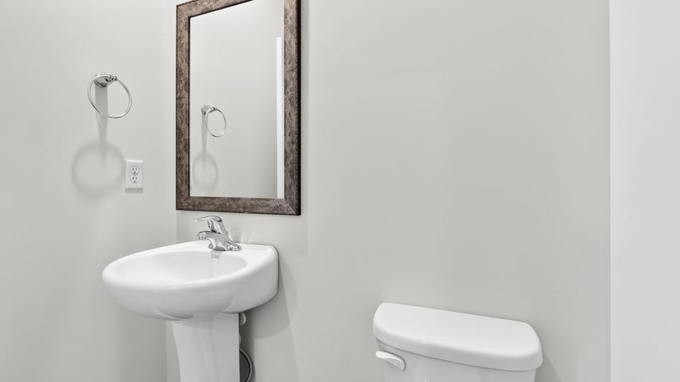 Half bath with sink and toilet
