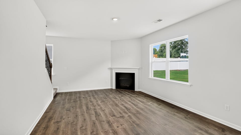 Living area with fireplace and window
