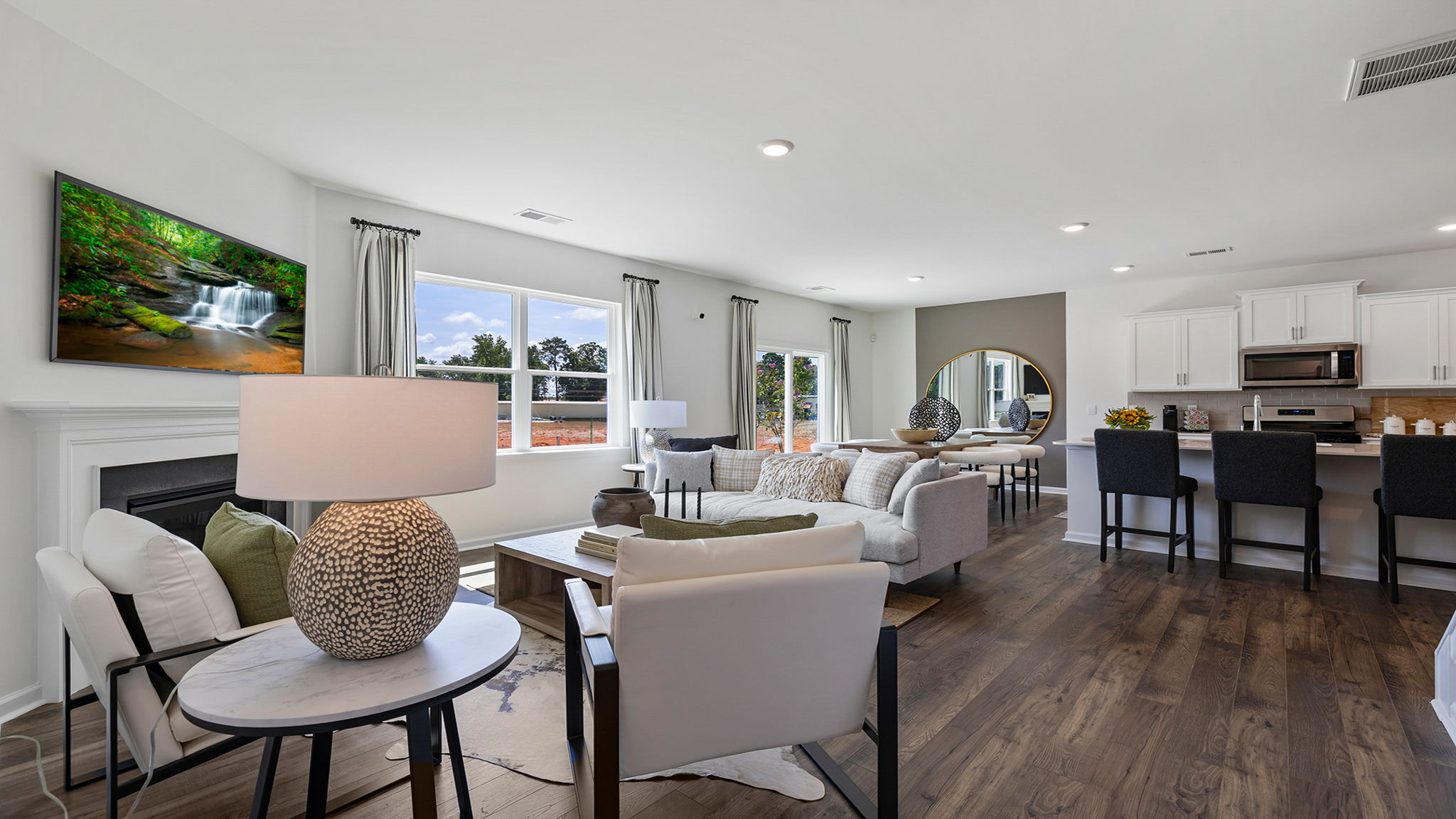 Living area with windows and fireplace.
