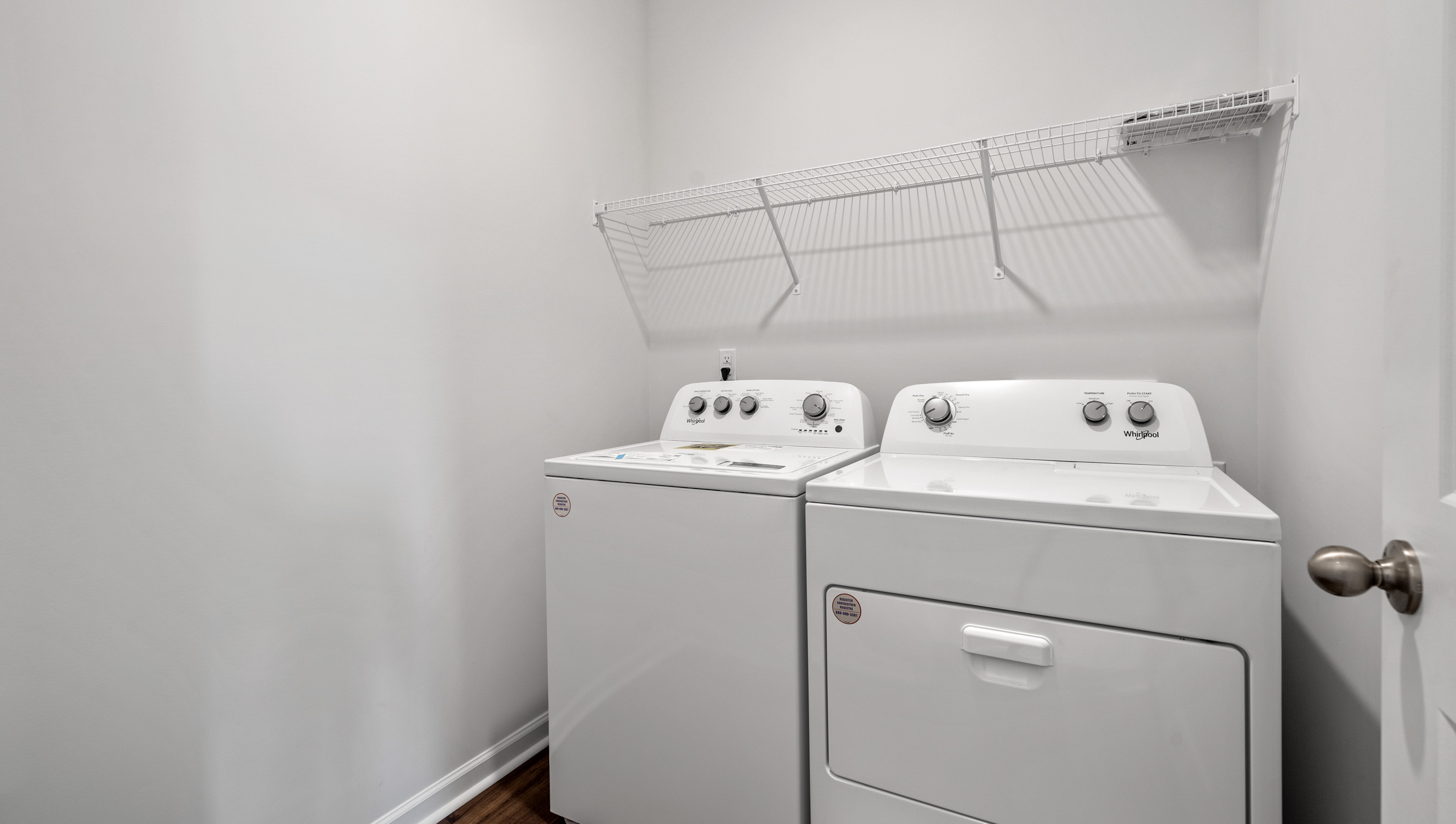 Laundry room with shelf.