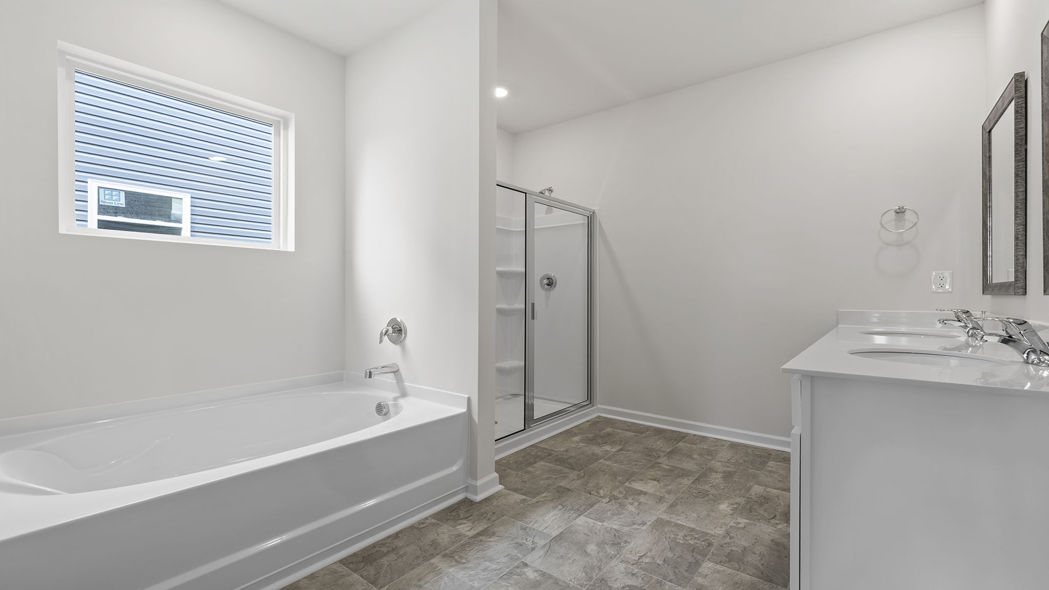 Primary bathroom with double vanity sinks.