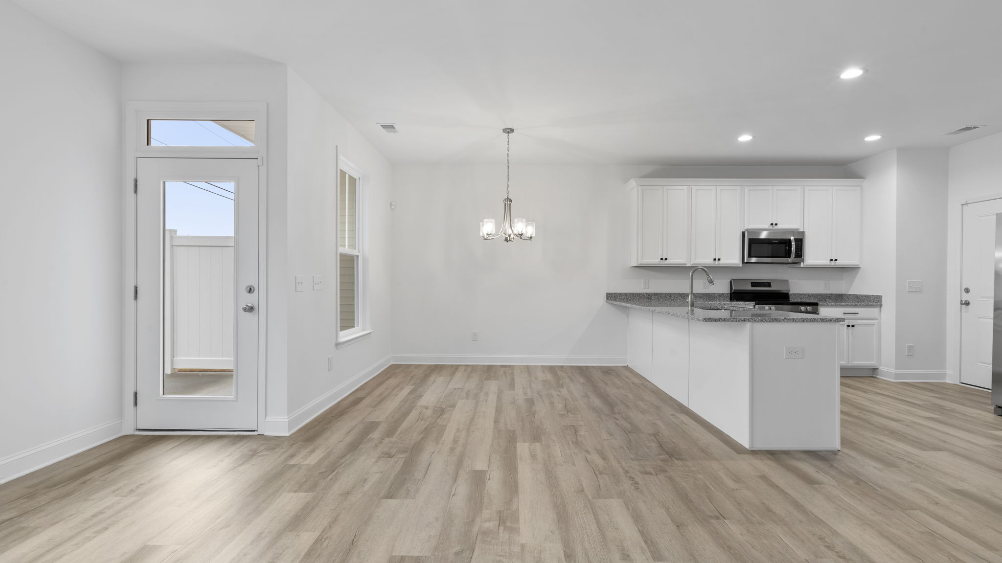 View of kitchen and dining area.