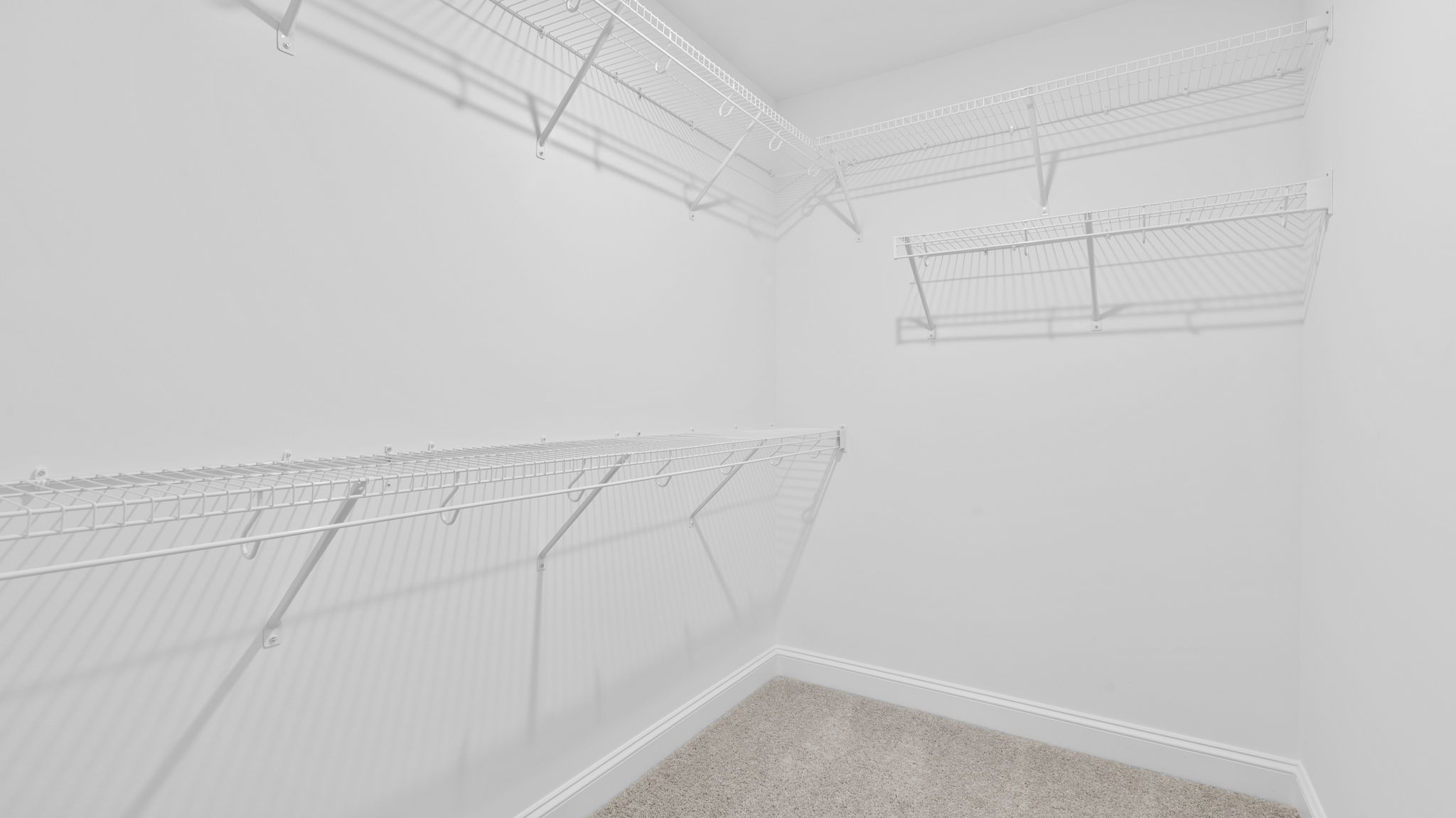 Primary bedroom walk-in closet.
