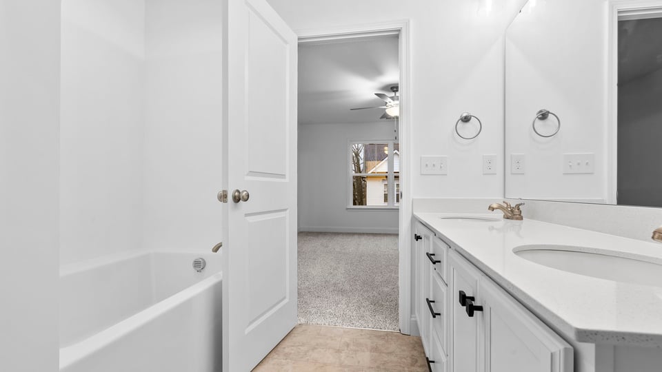 Primary bathroom with dual sink vanity.