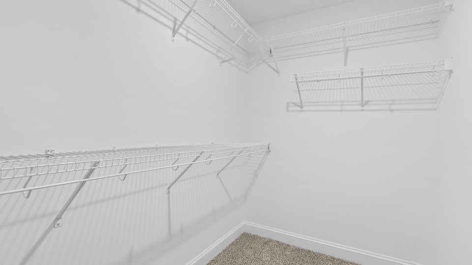 Primary bedroom walk-in closet.