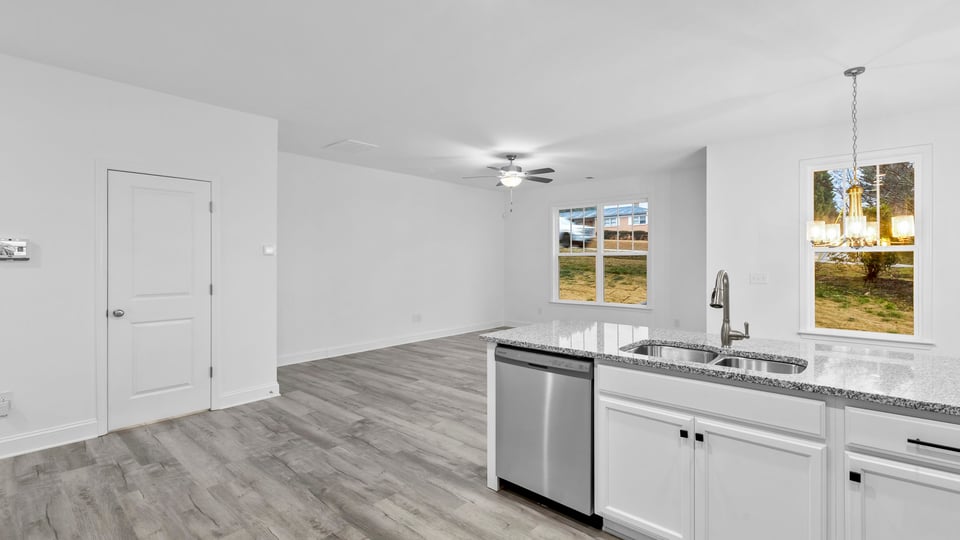 Kitchen with cabinets and window.