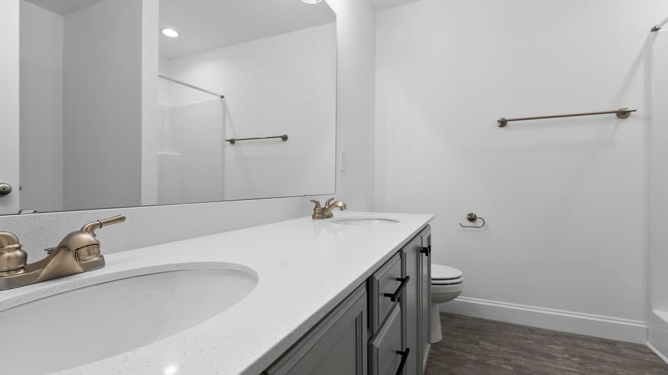 Primary bathroom with dual sink vanity.