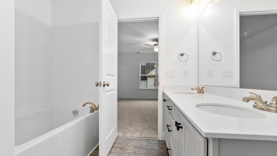 Primary bathroom with dual sink vanity.