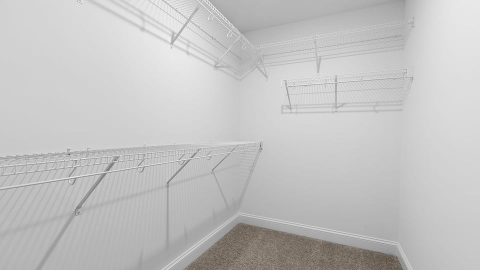 Primary bedroom walk-in closet.