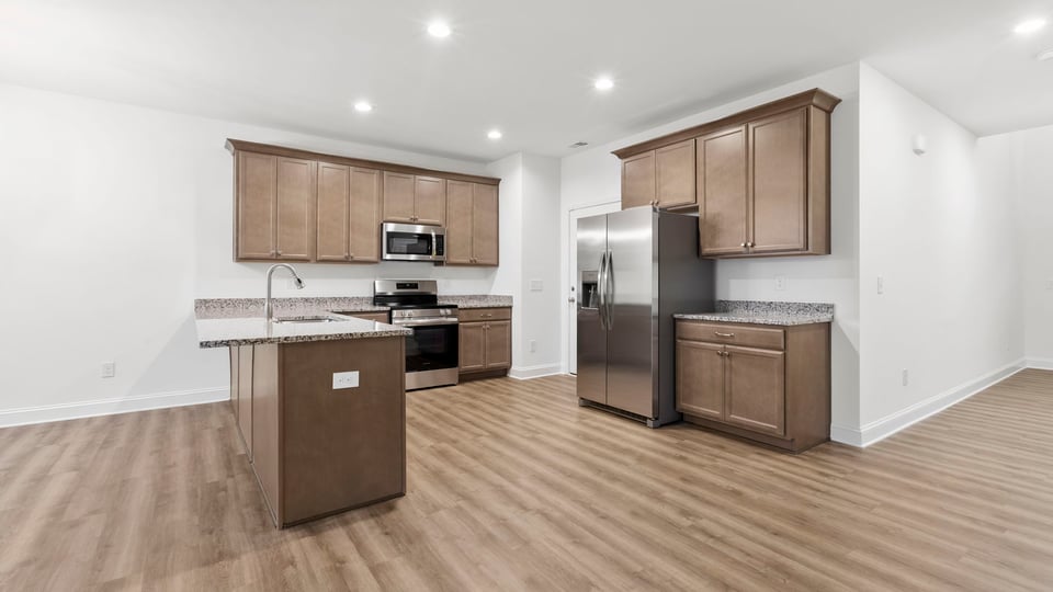 View of kitchen with island.
