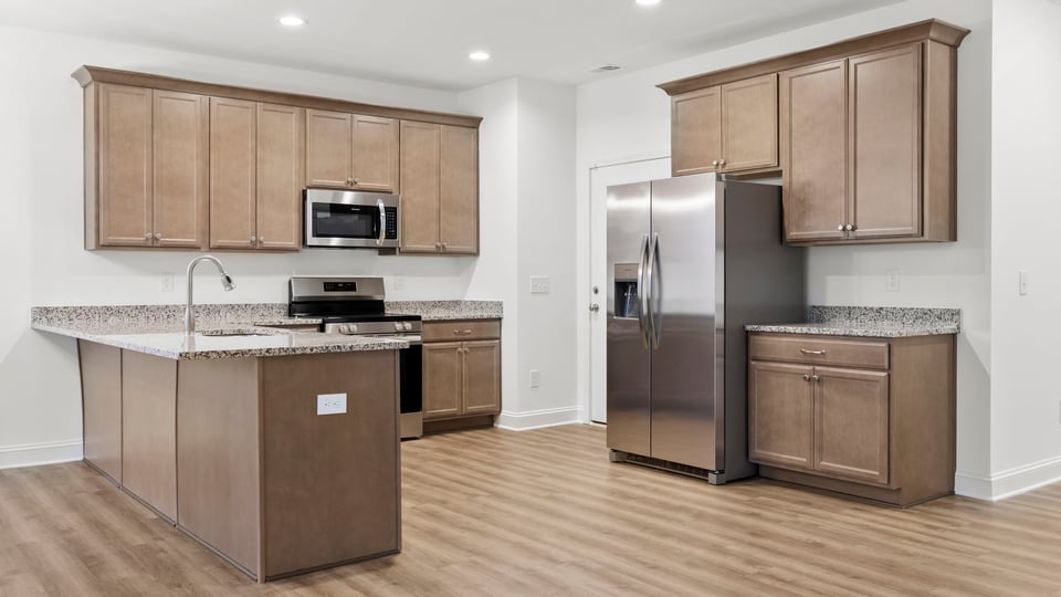 View of kitchen with island.