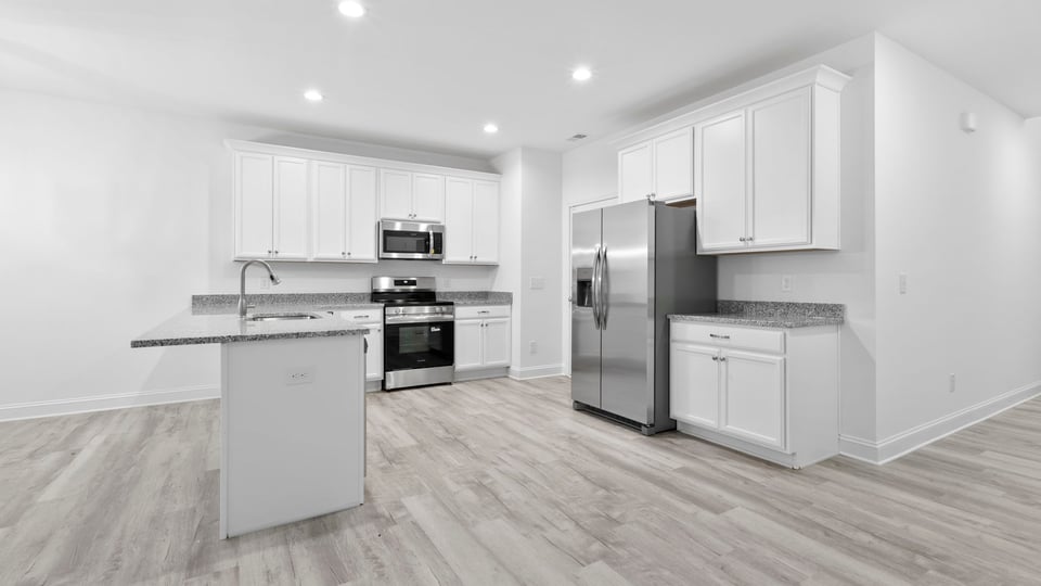 View of kitchen with island.