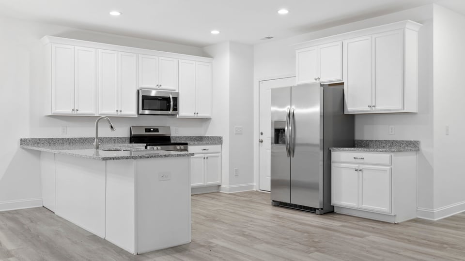 View of kitchen with island.