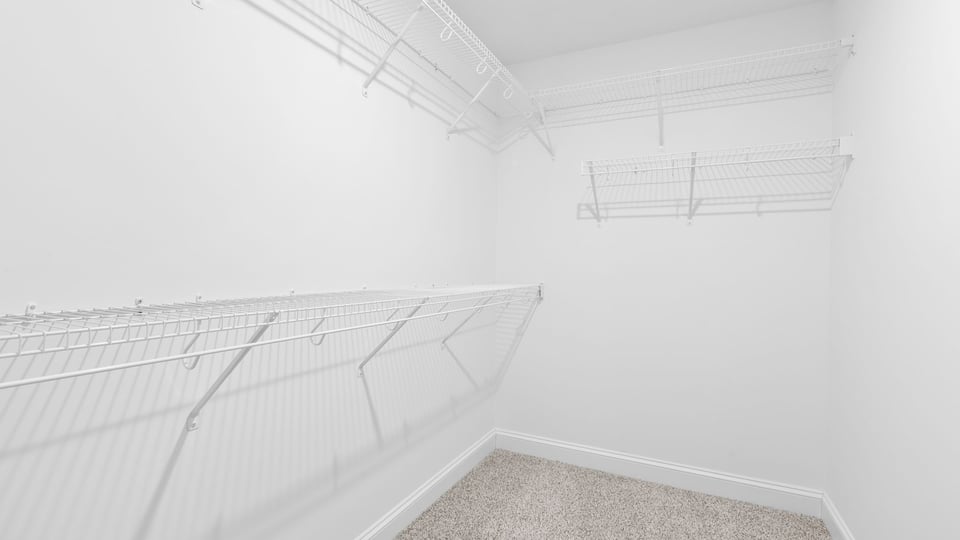 Primary bedroom walk-in closet.