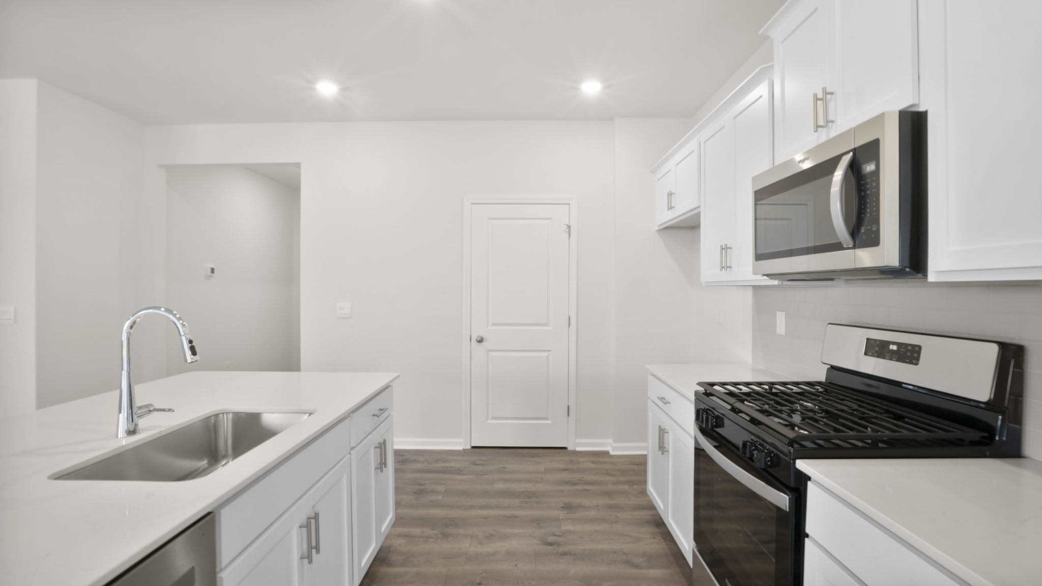 Kitchen features stainless steel appliances.