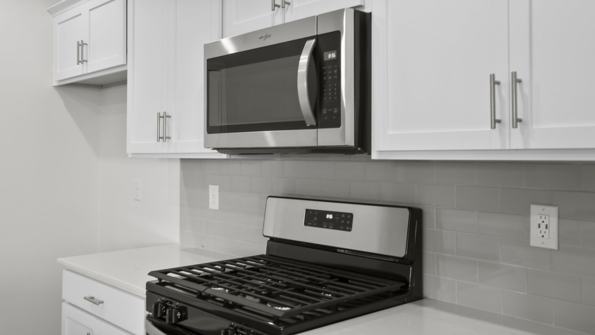 Kitchen features stainless steel appliances.