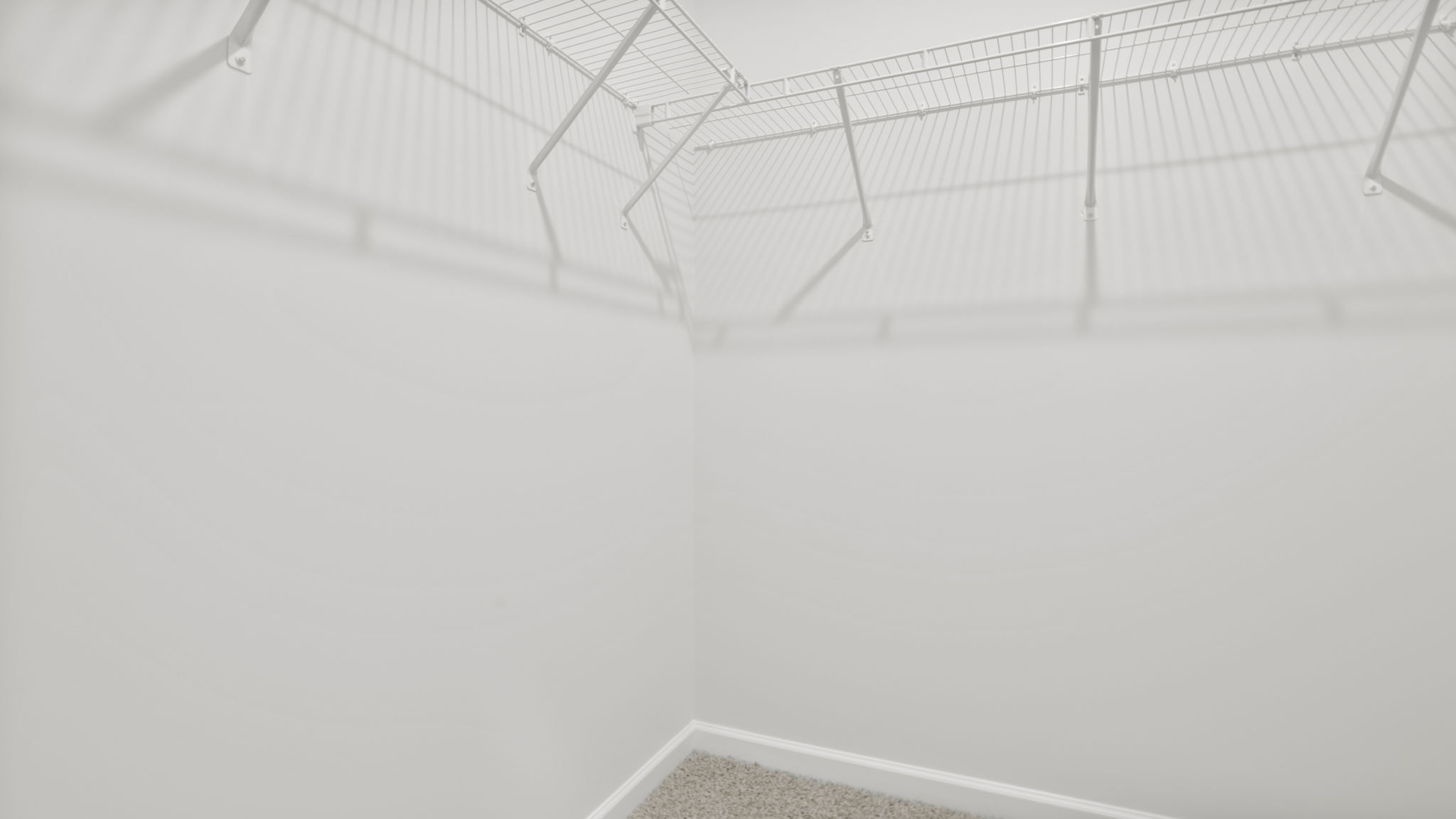 Primary bedroom walk in closet.