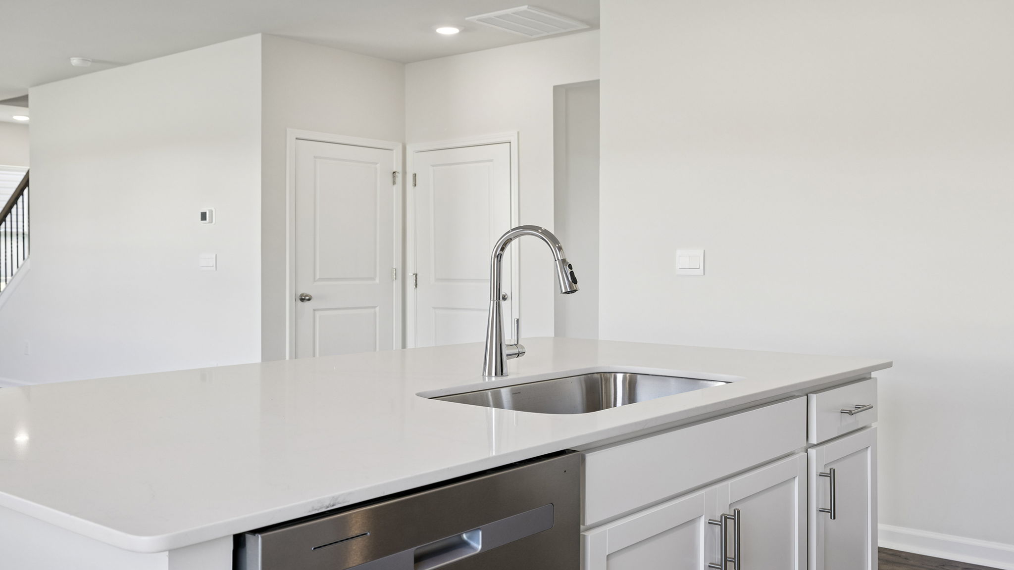 Island hosts the sink and dishwasher.