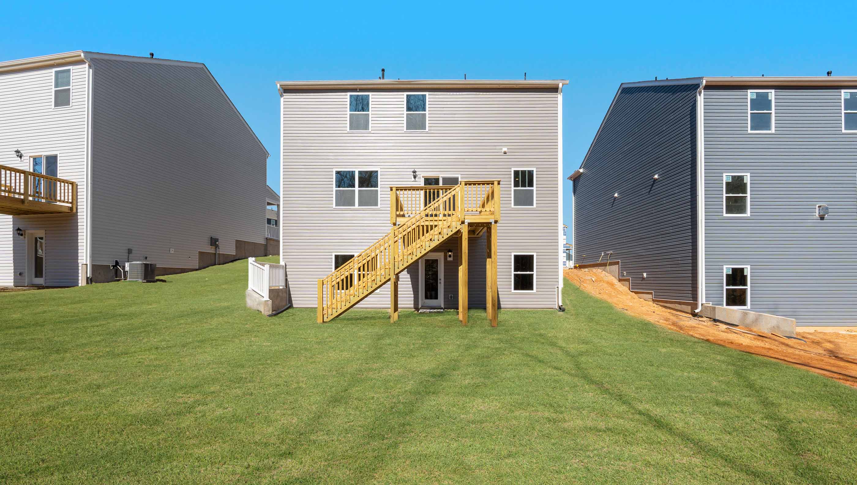 Back exterior with large backyard.