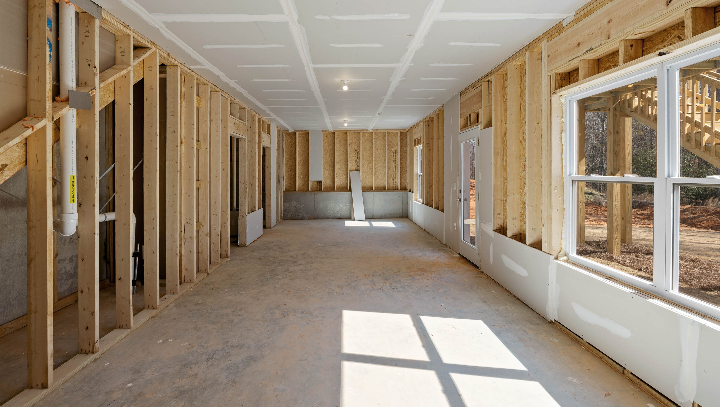 Unfinished basement with windows.