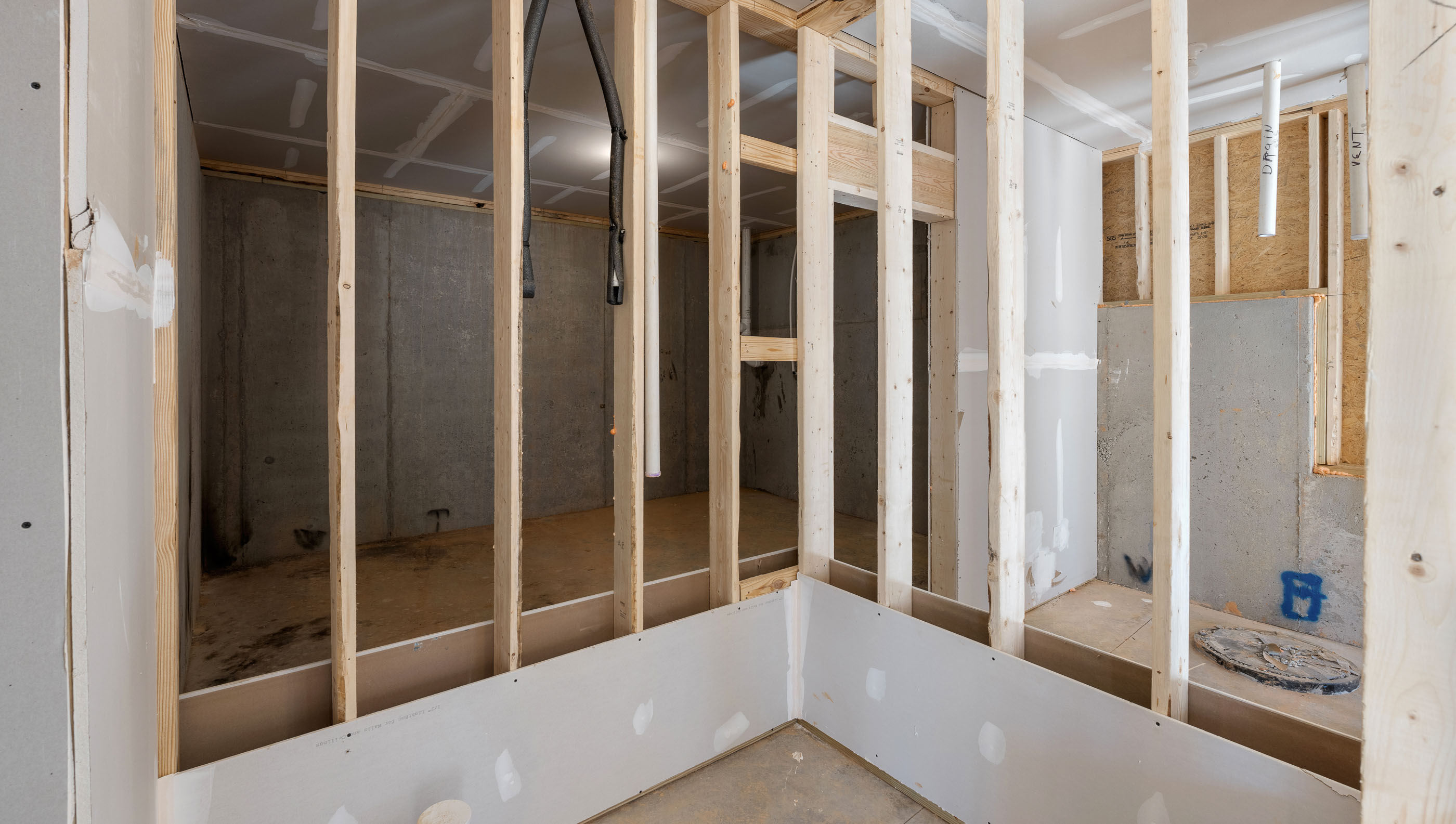 Unfinished basement with windows.