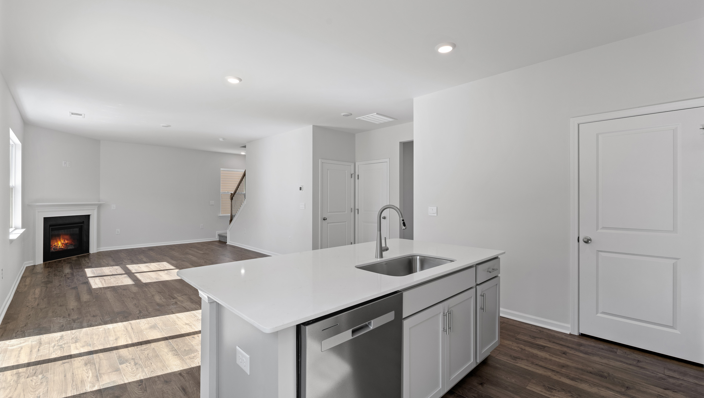 Kitchen with island and cabinets.