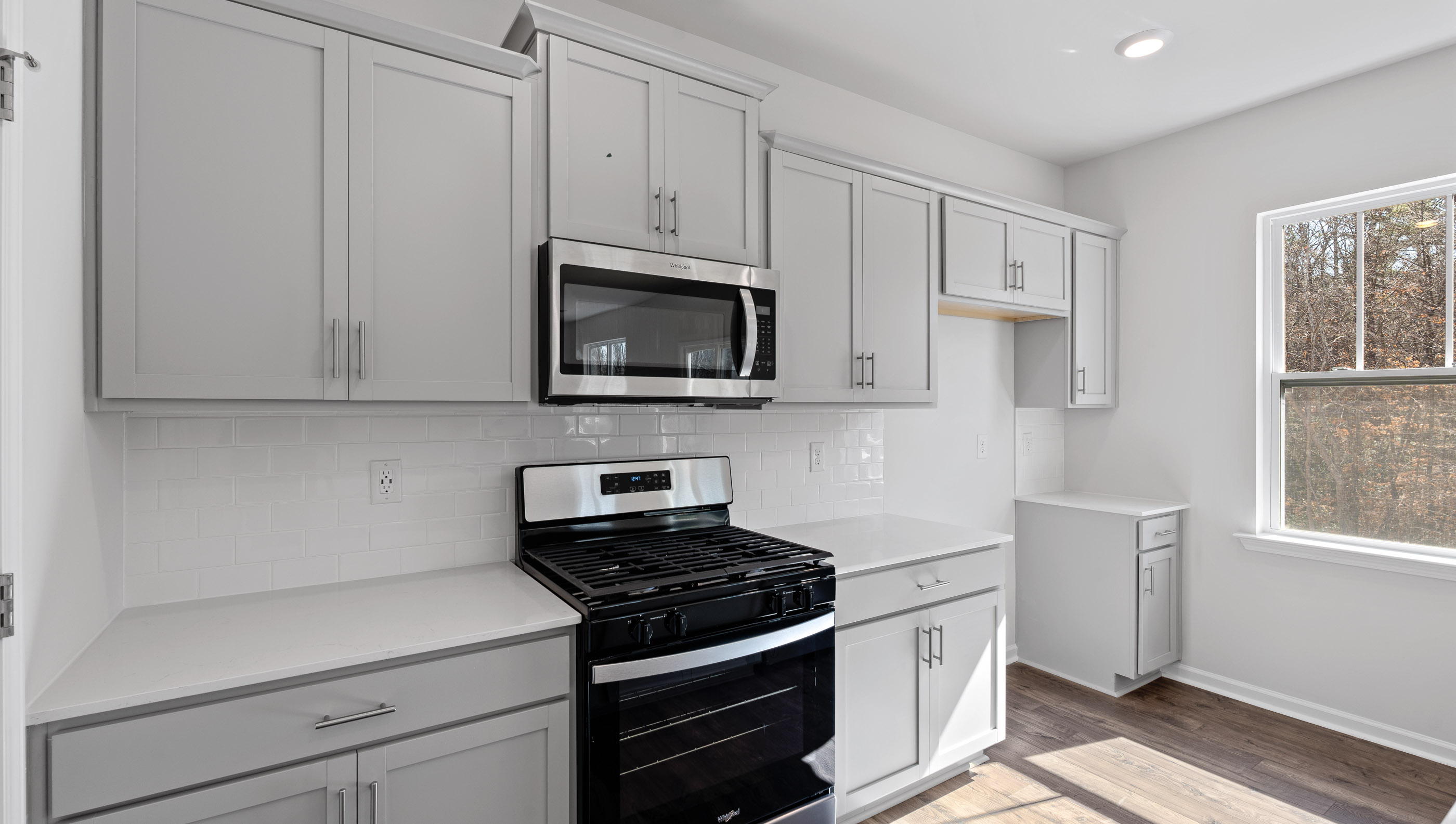 Kitchen with island and cabinets.