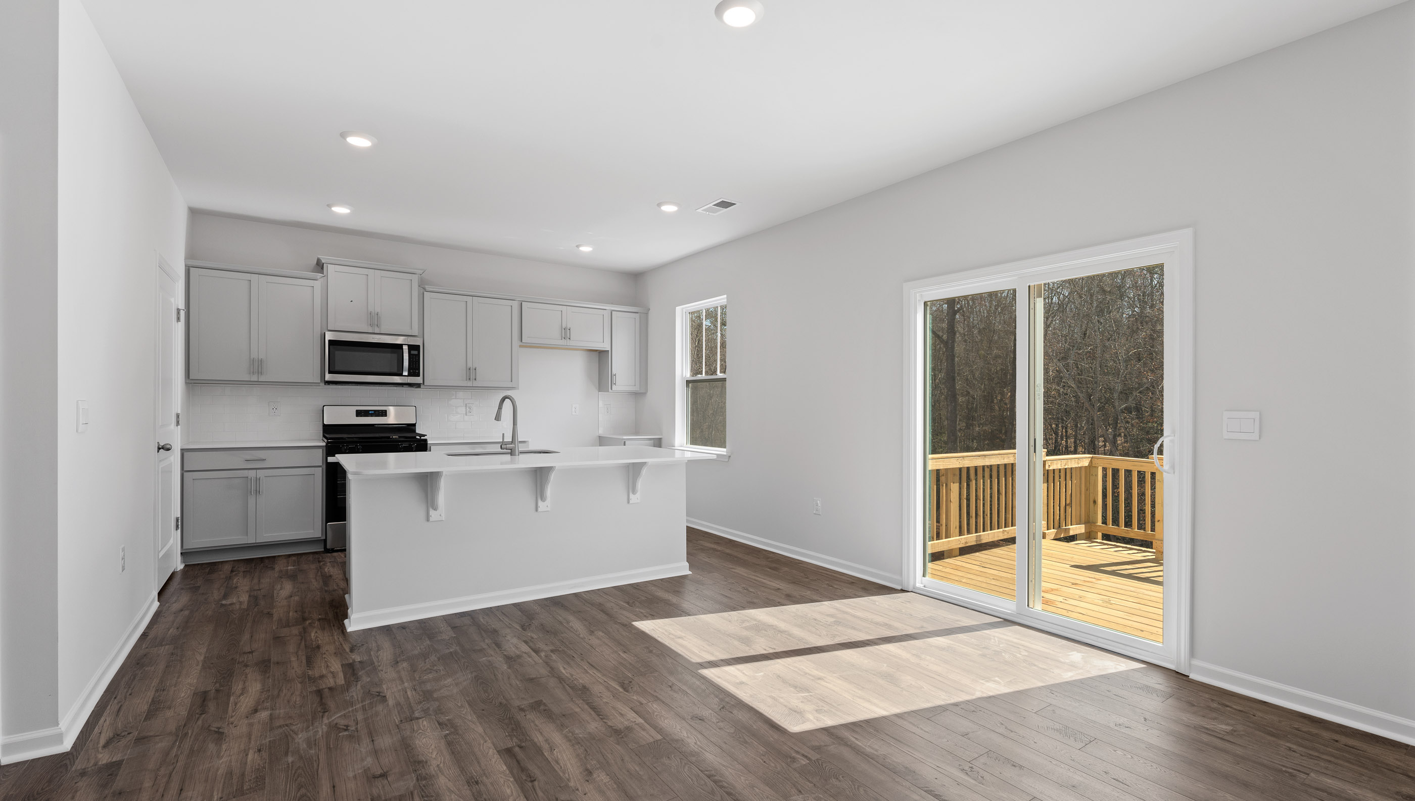 Living area with fireplace and windows.