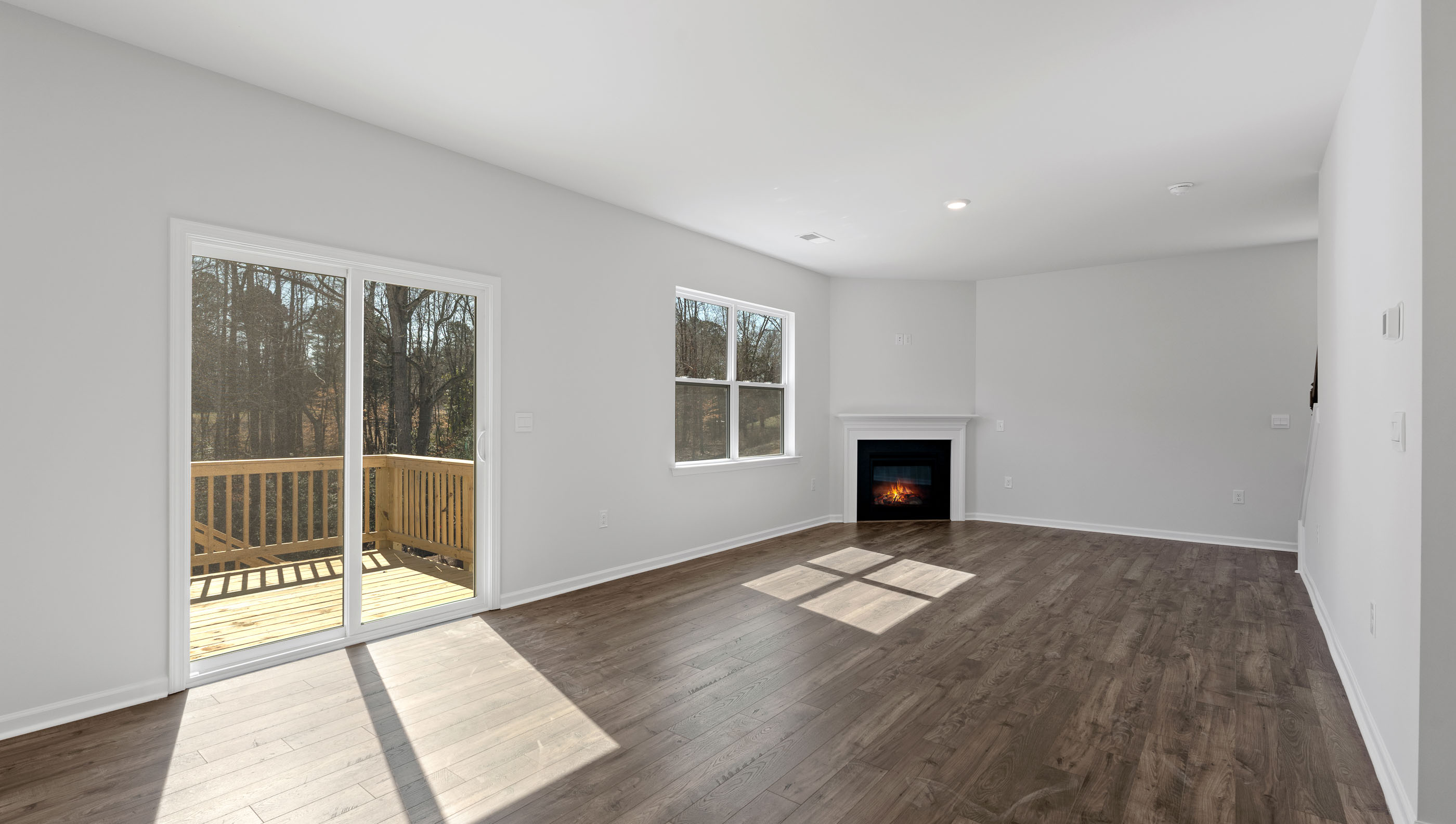 Living area with fireplace and windows.