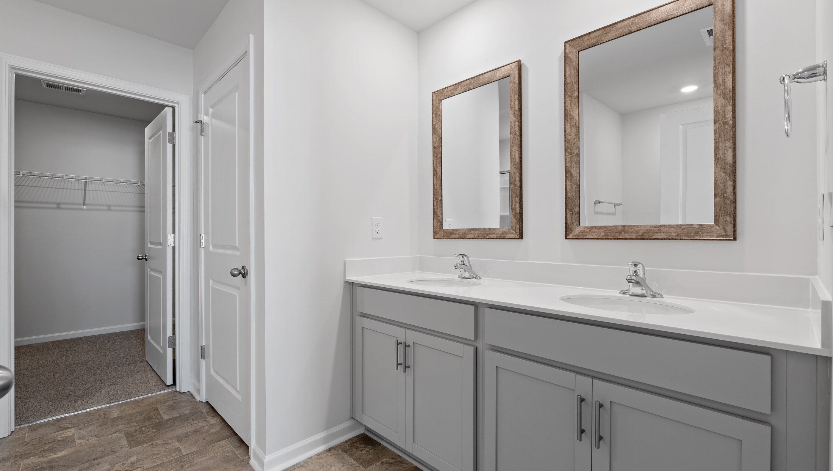 Primary bathroom with double vanity sinks.