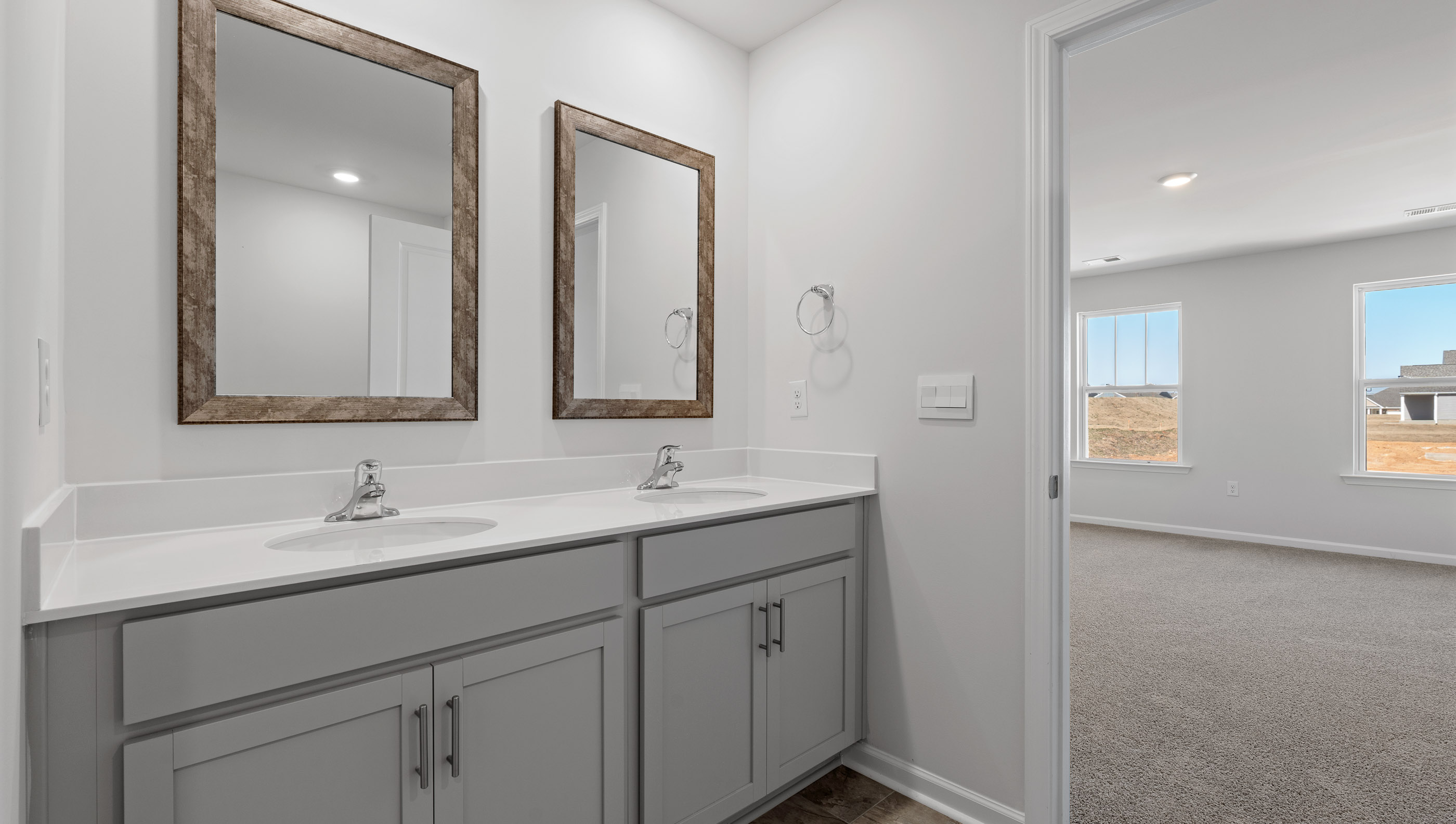 Primary bathroom with double vanity sinks.