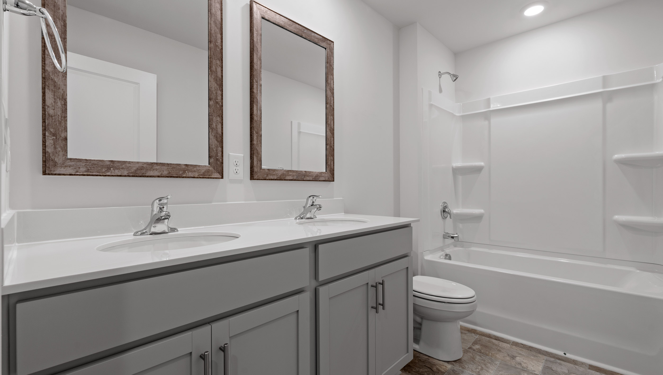 Bathroom with double vanitry sinks.