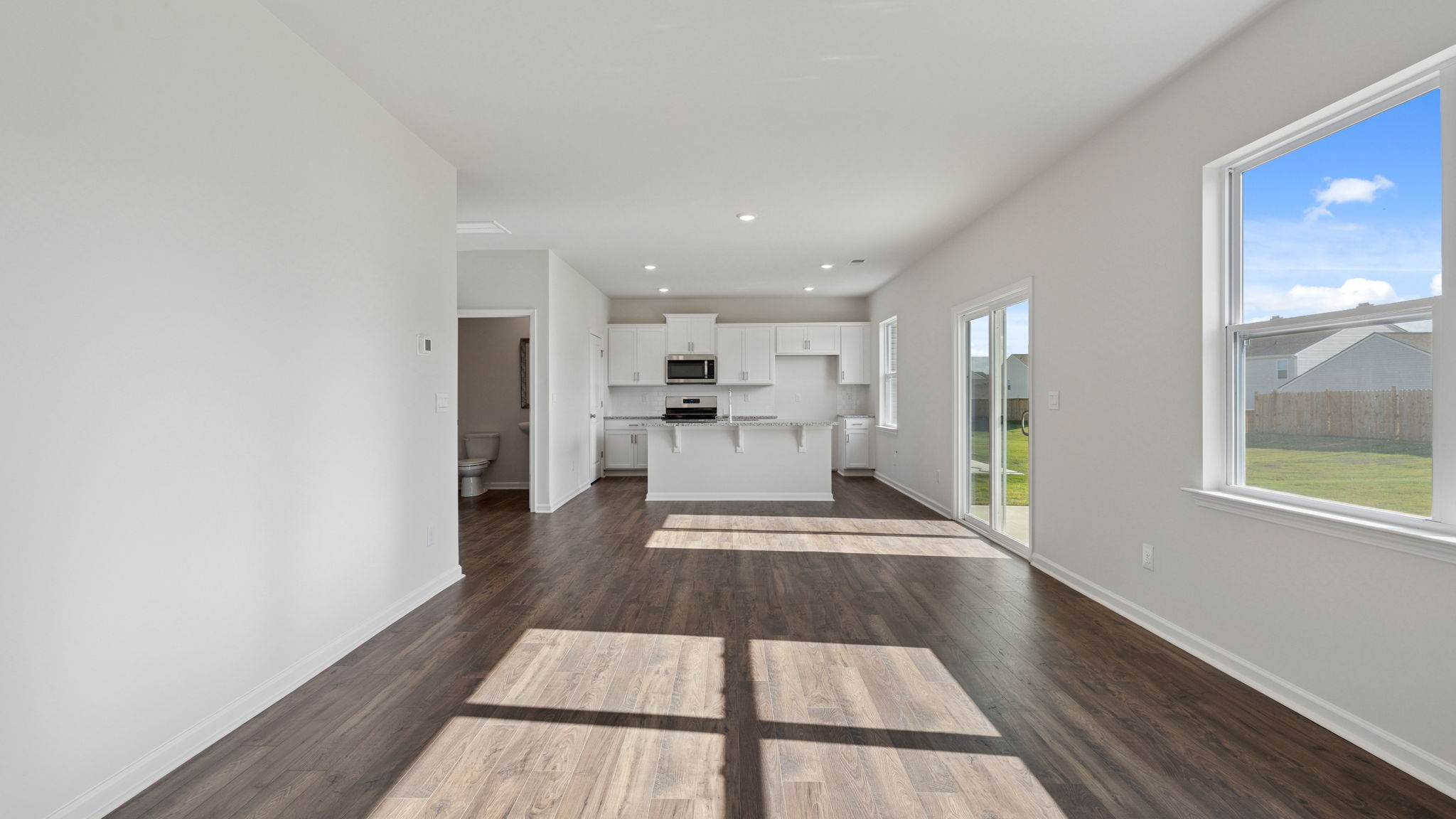View of combination living and dining area open to the kitchen.