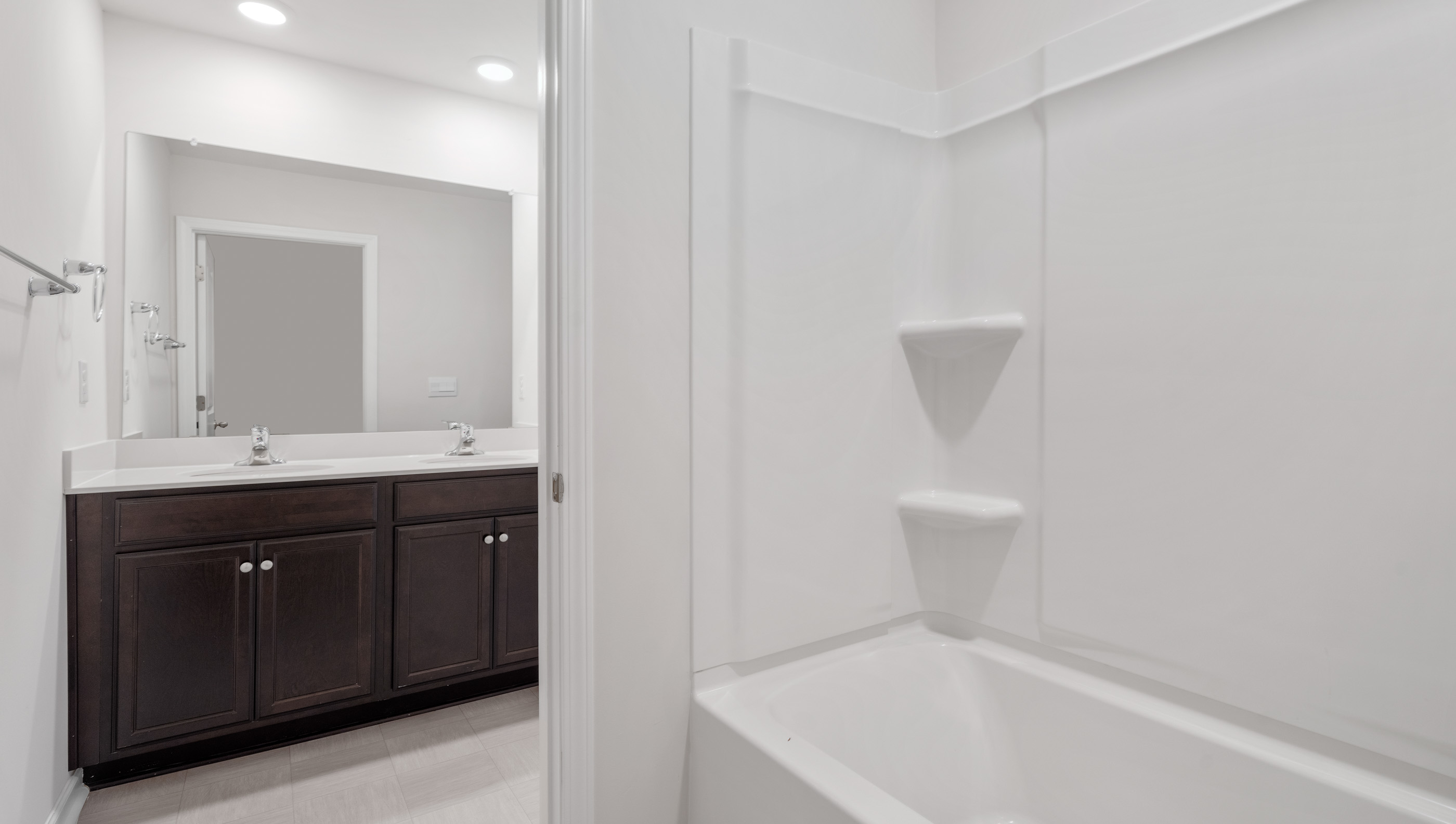 Separate shower area with combination shower / tub and toilet.