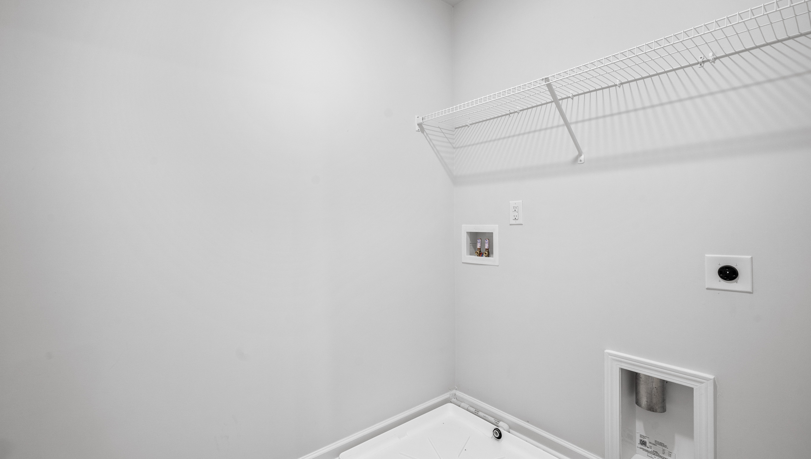 Primary bedroom walk-in closet.