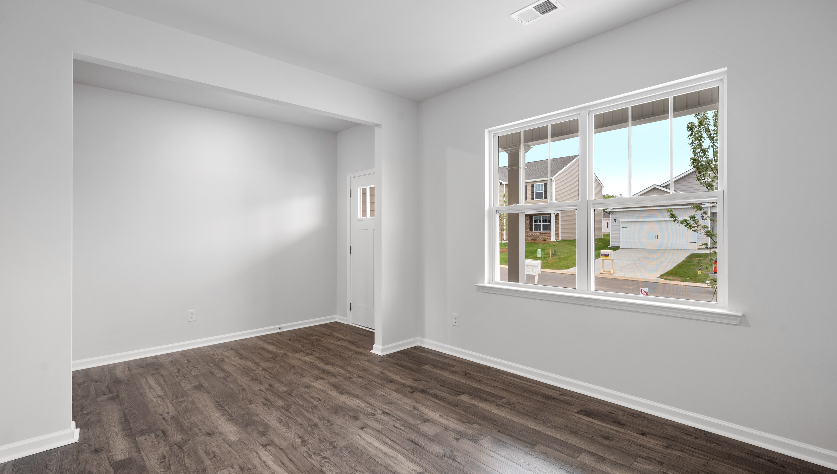 Study with windows and accented by French doors.