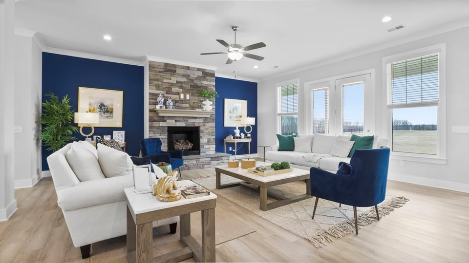 Livingroom with fireplace and windows.
